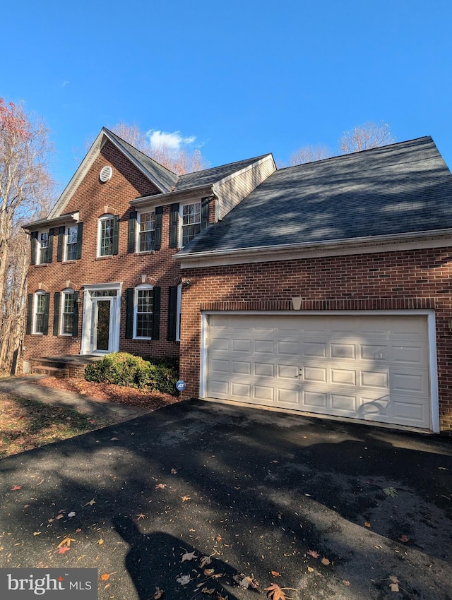 view of side of home featuring a garage