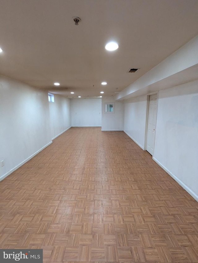 basement featuring light parquet floors