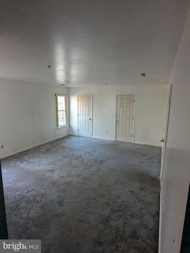 unfurnished room featuring carpet flooring