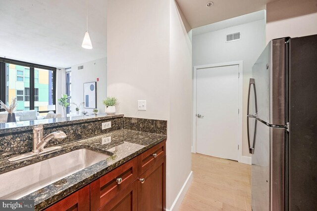 bathroom with vanity and hardwood / wood-style flooring