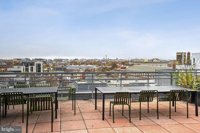 view of patio featuring a balcony