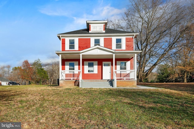 traditional style home featuring a porch and a front yard