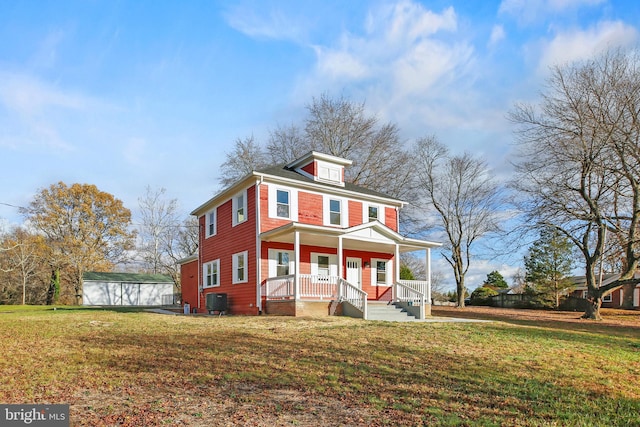 view of front of house with covered porch, a front lawn, and central air condition unit