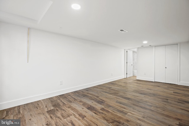 finished basement with recessed lighting, wood finished floors, visible vents, and baseboards