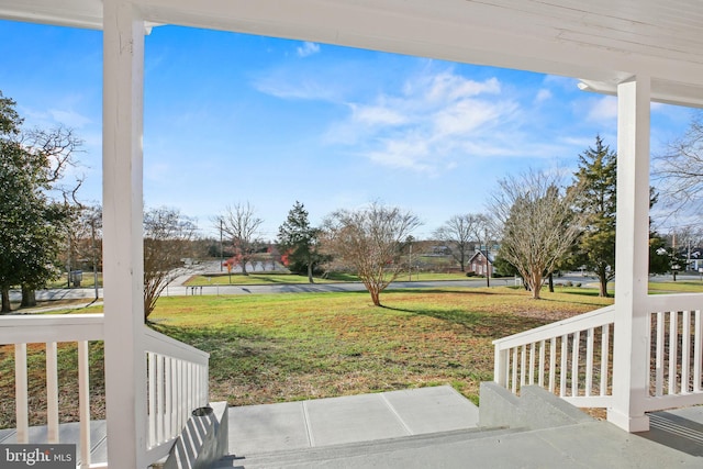 view of yard with covered porch