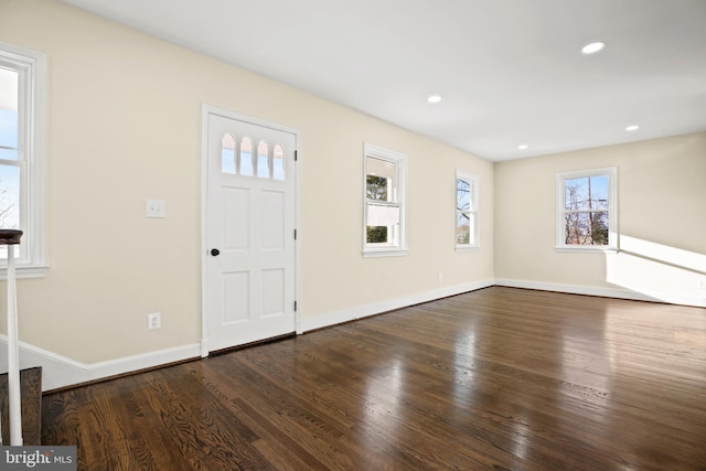 foyer with recessed lighting, wood finished floors, and baseboards