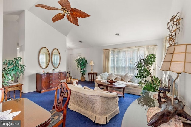 carpeted living room featuring vaulted ceiling and ceiling fan