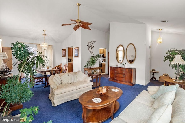 carpeted living room with ceiling fan with notable chandelier and vaulted ceiling