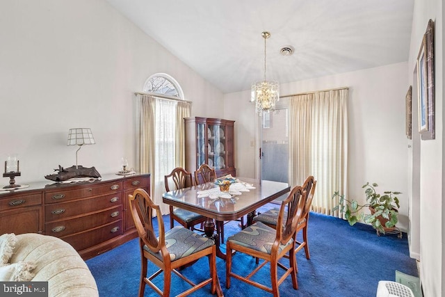 dining area with dark colored carpet, a notable chandelier, and high vaulted ceiling