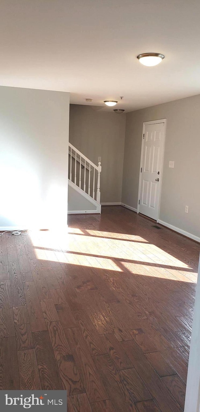 spare room with hardwood / wood-style flooring