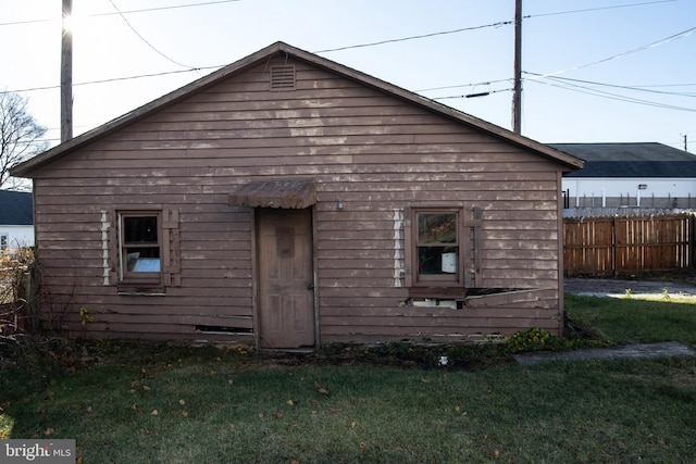 back of house with a yard