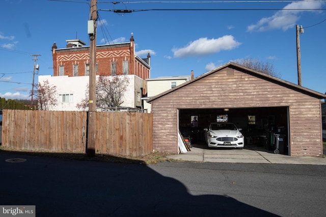 view of home's exterior featuring an outbuilding and a garage