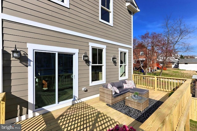 wooden deck featuring an outdoor hangout area