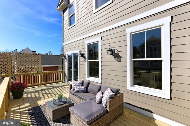 wooden deck featuring an outdoor hangout area