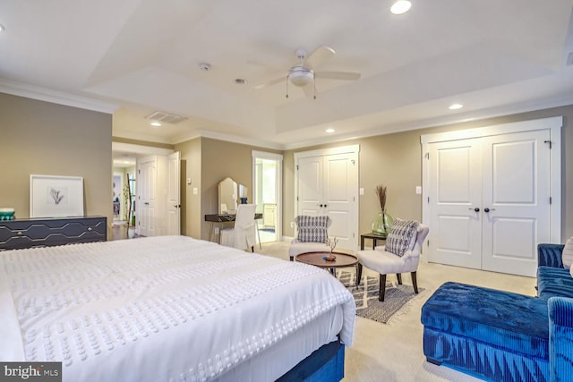 bedroom with light colored carpet, a raised ceiling, ceiling fan, and crown molding