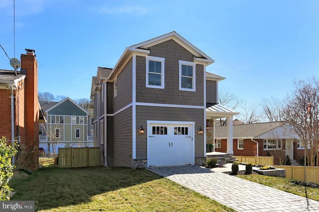 front of property with a front yard and a garage