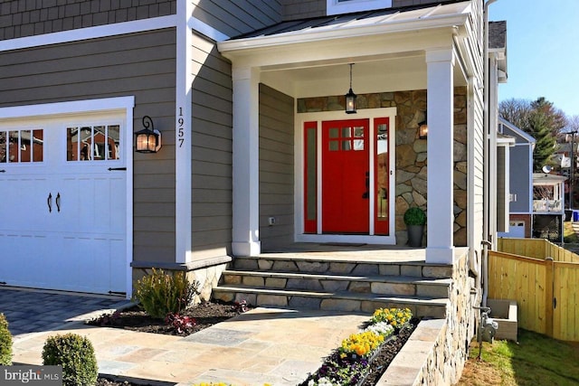 doorway to property with a garage