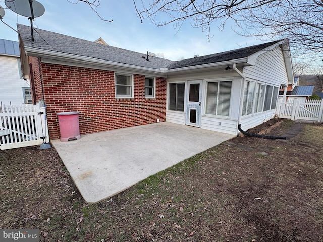 rear view of house featuring a patio area