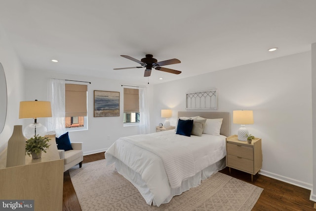 bedroom with ceiling fan and dark wood-type flooring