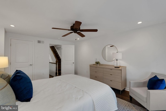 bedroom featuring ceiling fan and dark hardwood / wood-style floors