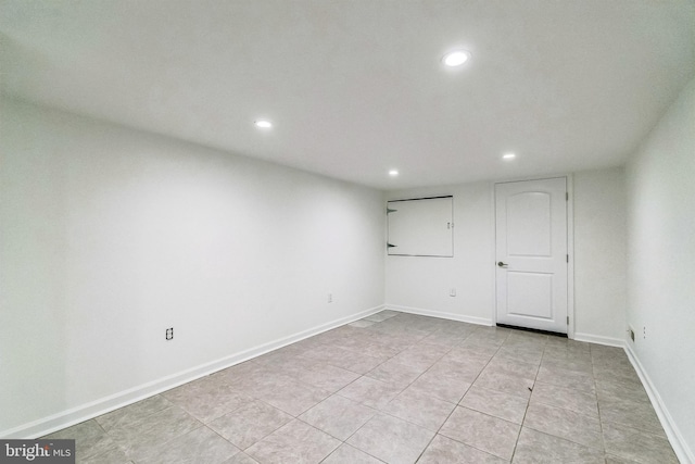 unfurnished room featuring light tile patterned floors