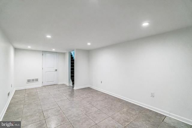 basement with light tile patterned flooring