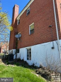 view of side of home featuring central air condition unit