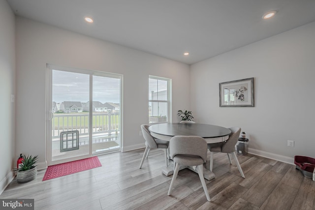 dining room with light hardwood / wood-style flooring