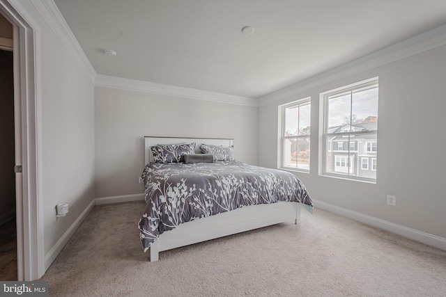 carpeted bedroom with crown molding