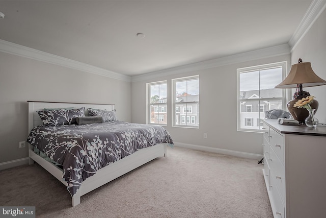 carpeted bedroom with ornamental molding and multiple windows