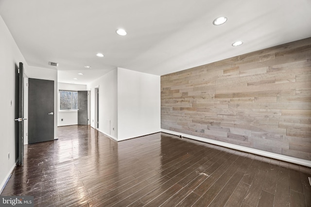 unfurnished room featuring dark hardwood / wood-style flooring