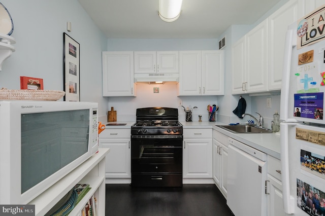 kitchen featuring white cabinets, dark hardwood / wood-style flooring, white appliances, and sink