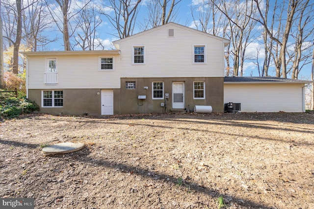 back of property featuring central AC unit