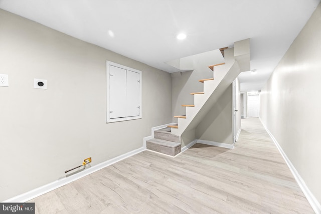 stairs featuring wood-type flooring