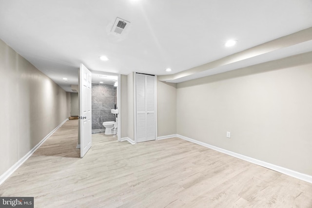 basement featuring light hardwood / wood-style flooring