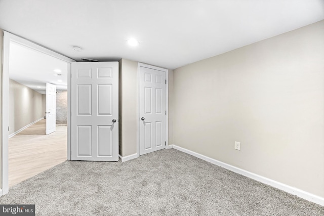 unfurnished bedroom with light carpet