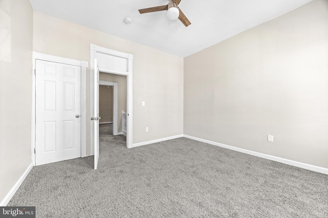 unfurnished bedroom featuring carpet flooring and ceiling fan