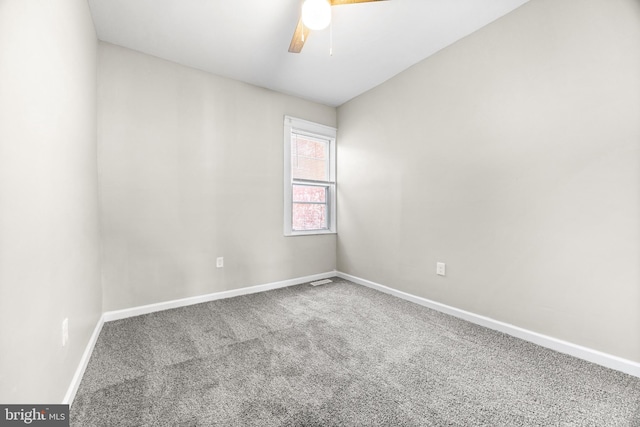 unfurnished room featuring ceiling fan, carpet floors, and lofted ceiling