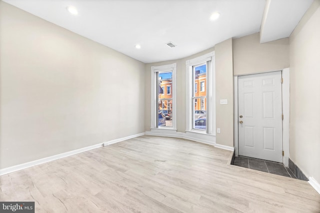 foyer entrance with light hardwood / wood-style flooring