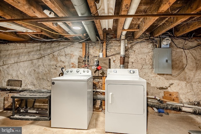 washroom with electric panel and washer and dryer