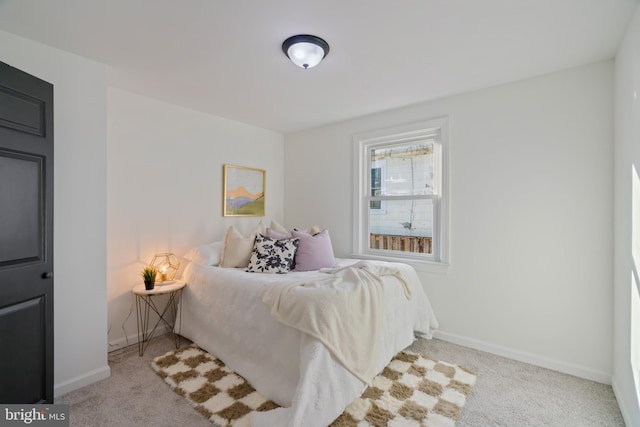 bedroom featuring light colored carpet