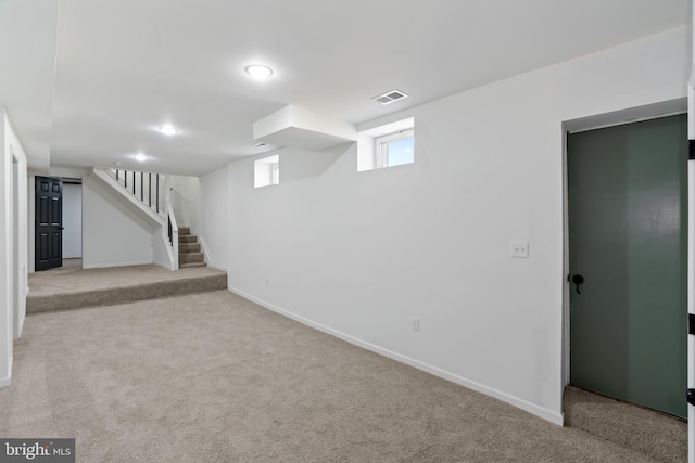 basement with light colored carpet