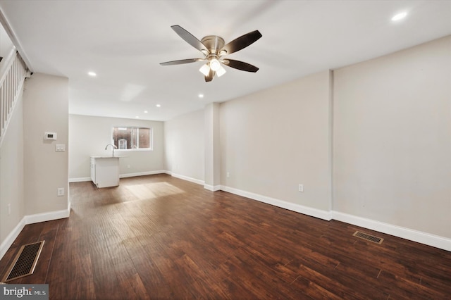 unfurnished living room with ceiling fan and hardwood / wood-style flooring