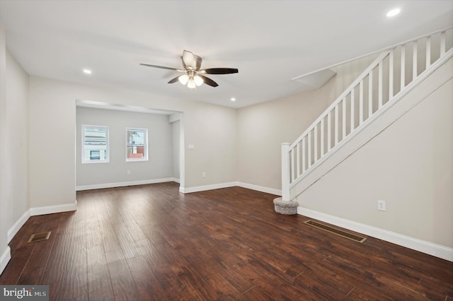 unfurnished room featuring ceiling fan and dark hardwood / wood-style flooring