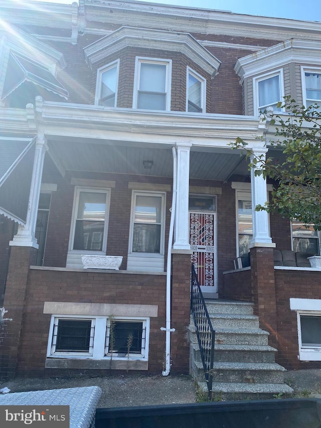 1808 N Bentalou St, Baltimore, MD 21216 - view of front facade featuring covered porch and brick siding