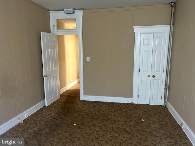 unfurnished room featuring crown molding