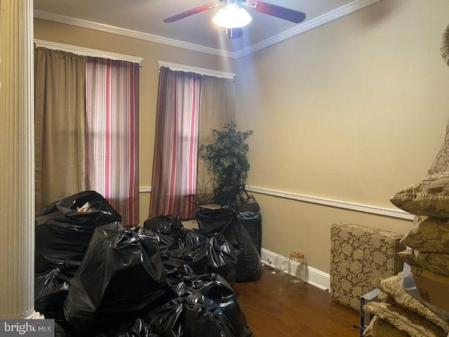 bedroom with ceiling fan, dark hardwood / wood-style floors, and crown molding