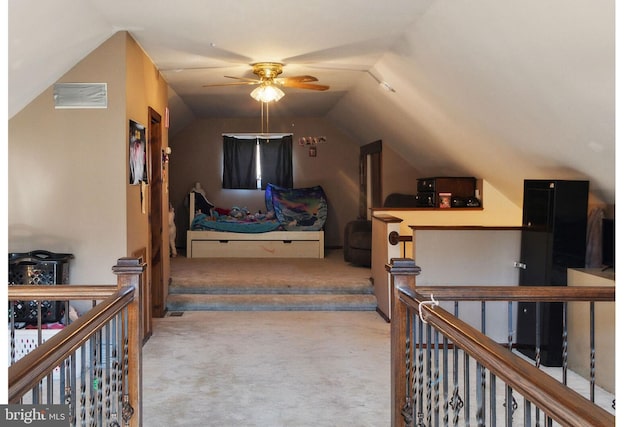 interior space featuring ceiling fan and lofted ceiling