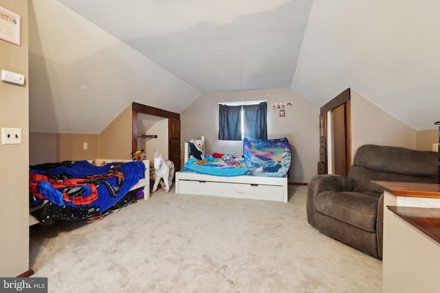 bedroom with carpet flooring and lofted ceiling