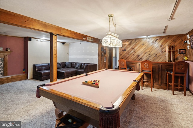 recreation room with carpet, wooden walls, pool table, and bar